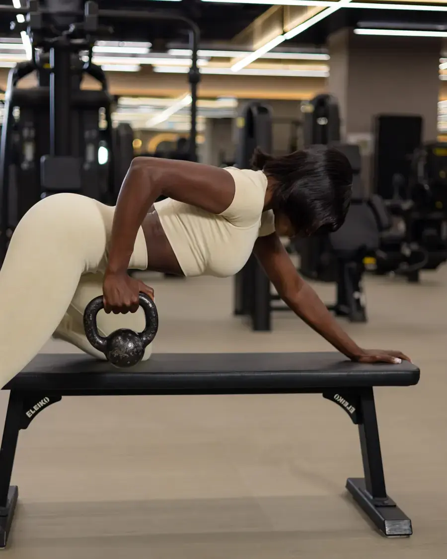 A member training with a kettlebell at FitnGlam